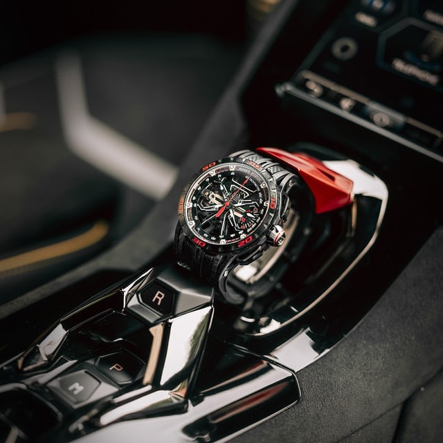 Roger Dubuis watch inside a Lamborghini on the start engine button