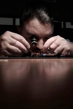 Focus on a watchmaker working on an exceptional timepiece
